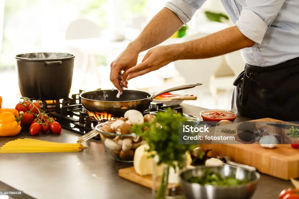 Chef preparing fresh ingredients in a clean kitchen